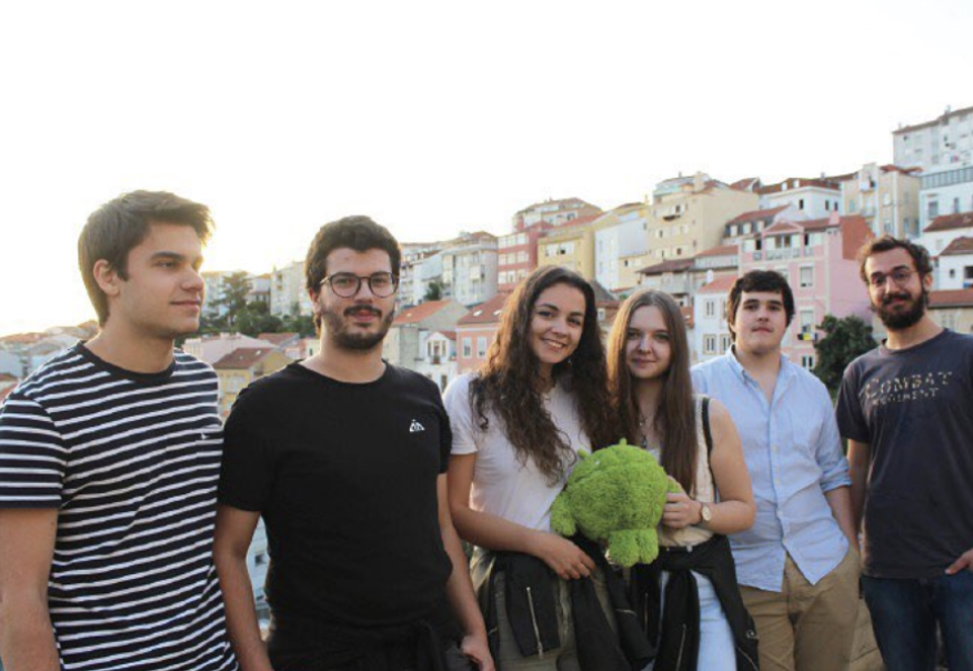 Summer interns 2019 holding the Android cuddly toy by the balcony
